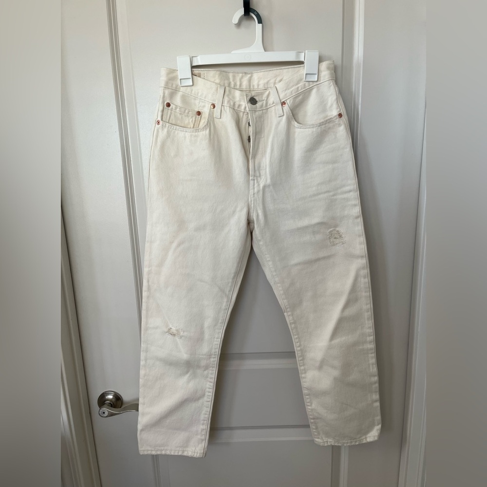 Cream high-waisted Levi’s jeans
